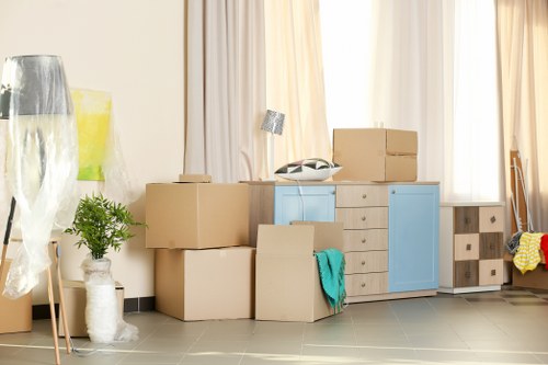 Careful unloading of household items for a West Kensington move
