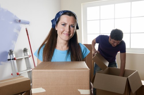 Local moving team handling boxes in a Westkensington property