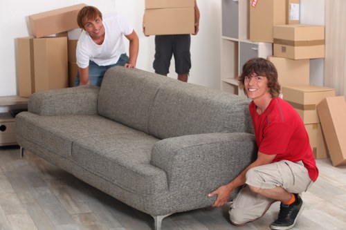Packed moving boxes and furniture ready for removals in Westkensington