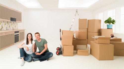 Professional removalists loading household items carefully